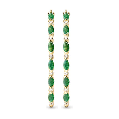 Close-up front view of a pair of yellow metal hoop earrings featuring alternating marquise-shaped green gemstones and round white gemstones in prong settings.