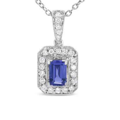 Front-facing close-up of a white metal necklace pendant featuring a central emerald-shaped purple gemstone in a prong setting, surrounded by a border of round white gemstones in a pave setting, with additional round white gemstones on the bail.