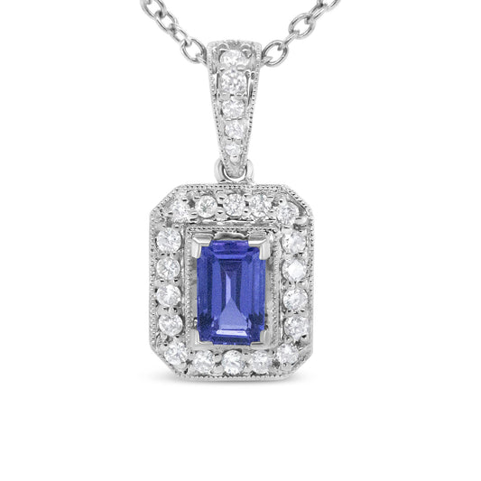Front-facing close-up of a white metal necklace pendant featuring a central emerald-shaped purple gemstone in a prong setting, surrounded by a border of round white gemstones in a pave setting, with additional round white gemstones on the bail.
