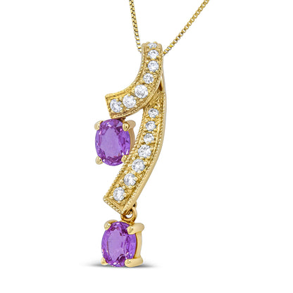Yellow metal necklace pendant with curved bars set with round white gemstones and two oval purple gemstones, shown in a close-up frontal view.