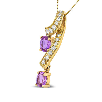 Yellow necklace pendant featuring two curved bars set with round white gemstones and two oval pink gemstones, shown in a close-up side angle.