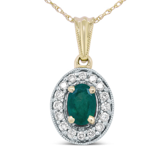 Front-facing close-up of a yellow metal necklace pendant featuring an oval green gemstone surrounded by a halo of round white gemstones in prong settings.