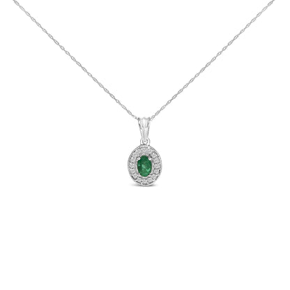 White necklace with an oval green gemstone pendant surrounded by round white gemstones, shown in a front-facing shot on a white background.