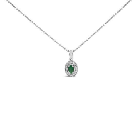 White necklace with an oval green gemstone pendant surrounded by small white gemstones in a pave setting, shown in a front-facing angle on a white background.