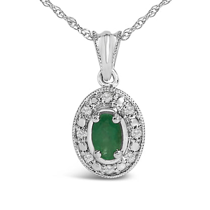 White metal necklace shown in a close-up front view with an oval-shaped green gemstone pendant surrounded by round white gemstones in a pave setting.