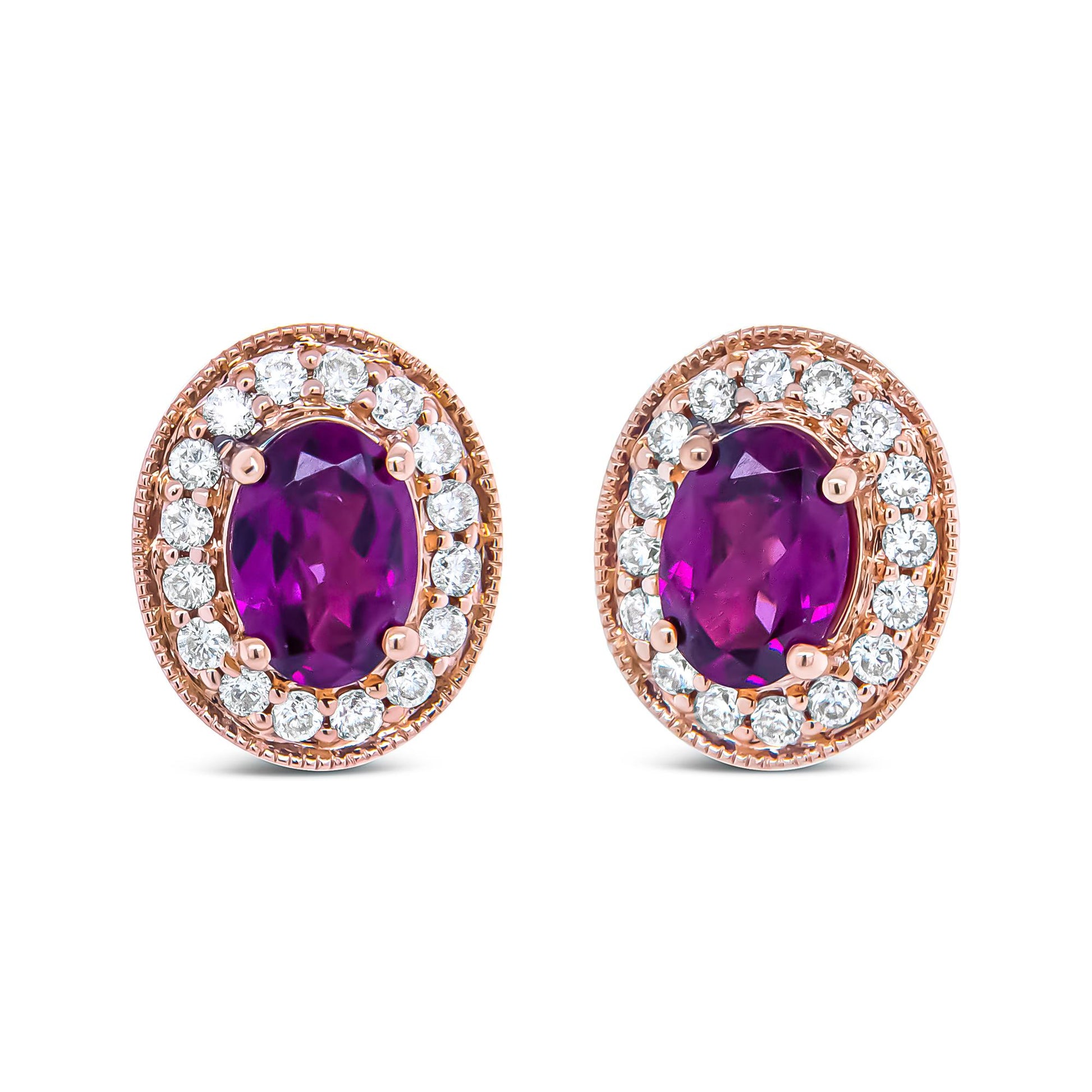 Front-facing pair of rose metal oval earrings with central red and purple oval gemstones surrounded by a halo of round white gemstones in prong settings.