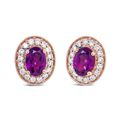 Front-facing pair of rose metal oval earrings with central red and purple oval gemstones surrounded by a halo of round white gemstones in prong settings.