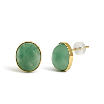 Close-up front and side view of oval green gemstone stud earrings with yellow metal bezel settings shown on a white background.