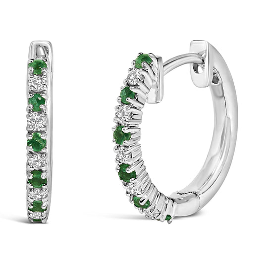 Pair of white metal hoop earrings with alternating round white and green gemstones in prong settings, shown from front and side angles on a white background.