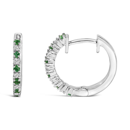 Close-up front and side view of white metal hoop earrings adorned with alternating prong-set round white and green gemstones.