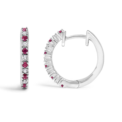 Close-up front and side view of white metal hoop earrings with alternating red and white round gemstones in prong settings.