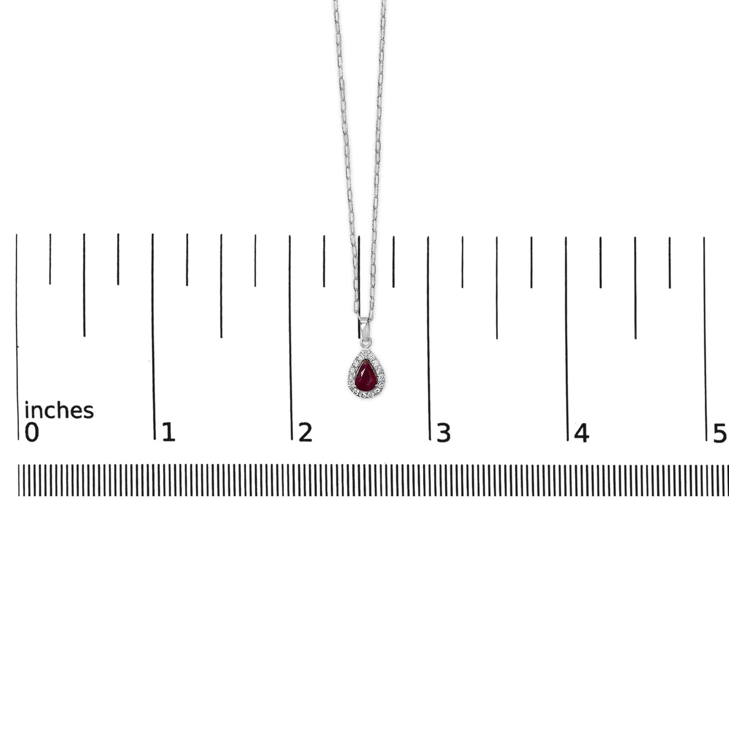 White necklace with a pear-shaped red gemstone pendant surrounded by small round white gemstones, shown on a scale with a top-down view.