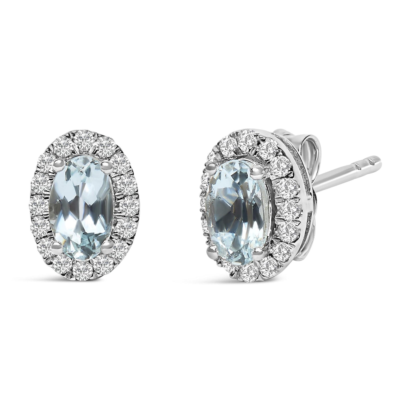 Front and side angled view of white metal stud earrings featuring oval blue gemstones surrounded by small round white gemstones in a pave setting.