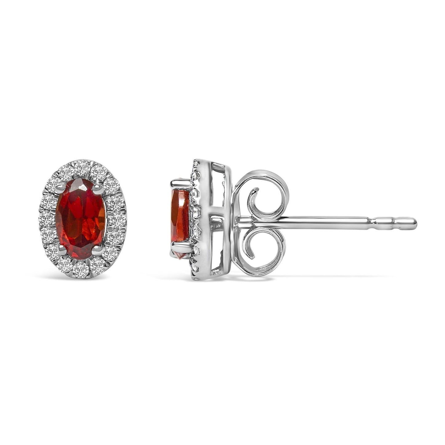 Pair of white metal earrings with oval red gemstones surrounded by round white gemstones, shown from front and side angles.