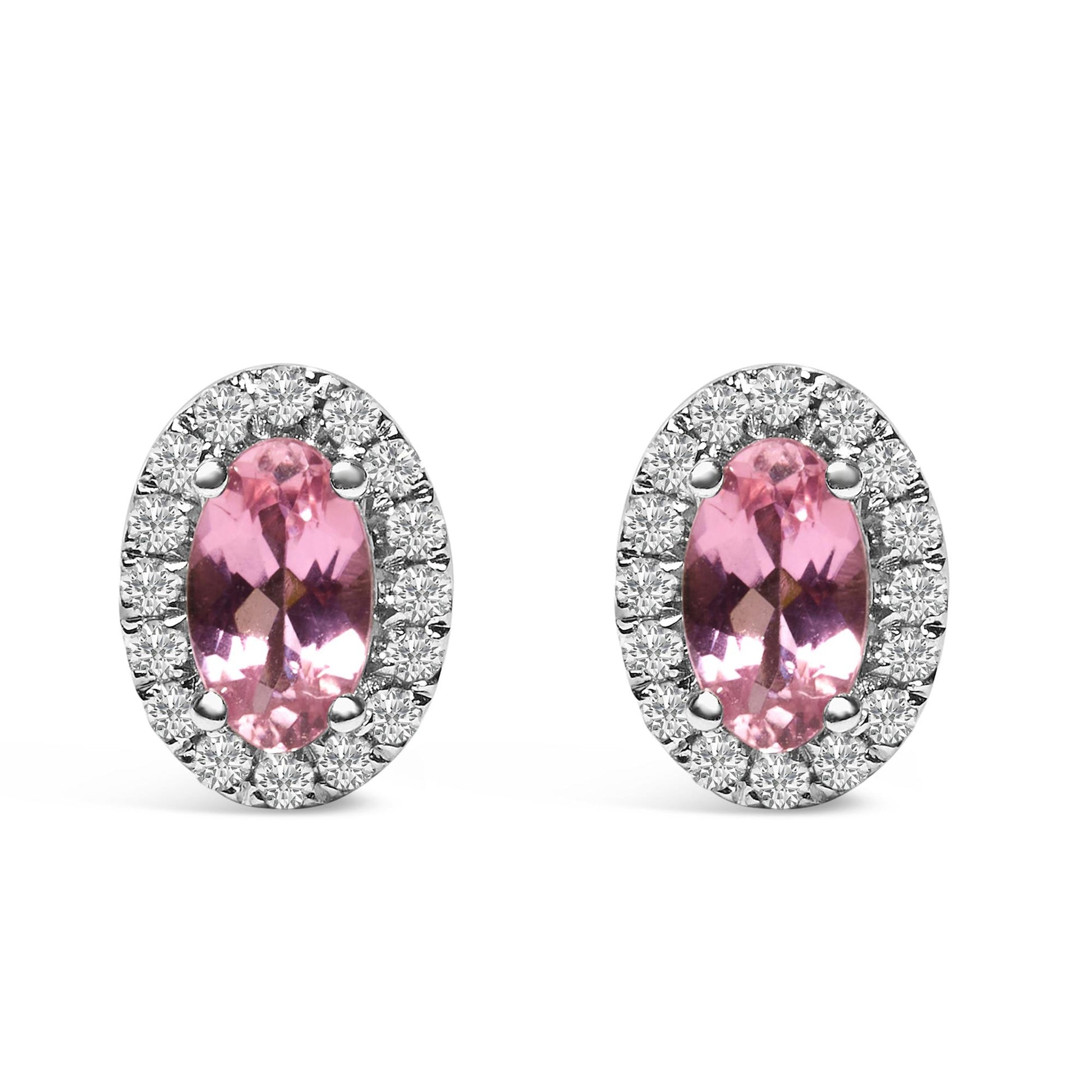 Pair of oval-shaped white metal stud earrings shown from the front, each featuring a central pink oval gemstone surrounded by a halo of round white gemstones in pave setting.