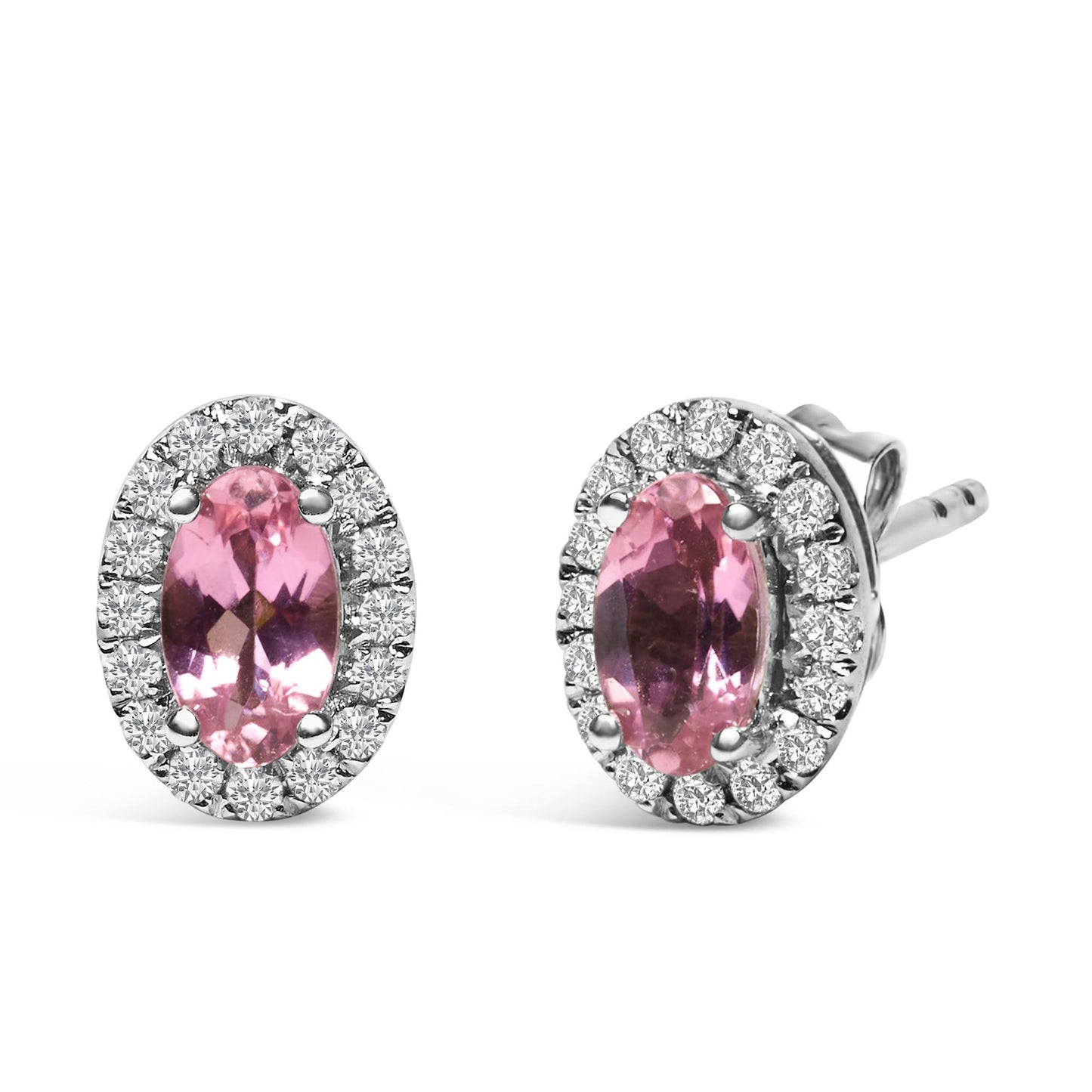 Pair of white metal stud earrings with oval pink gemstones surrounded by white round gemstones in pave setting, shown from a front and angled side view.