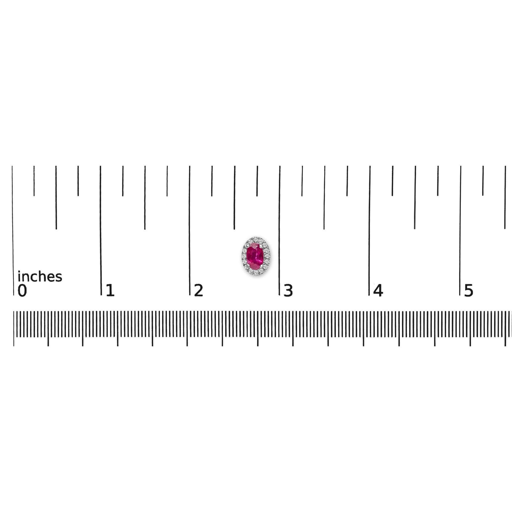 Single white metal earring with an oval red gemstone surrounded by small white gemstones in a pave setting, shown on a ruler for size reference, top-down angle.