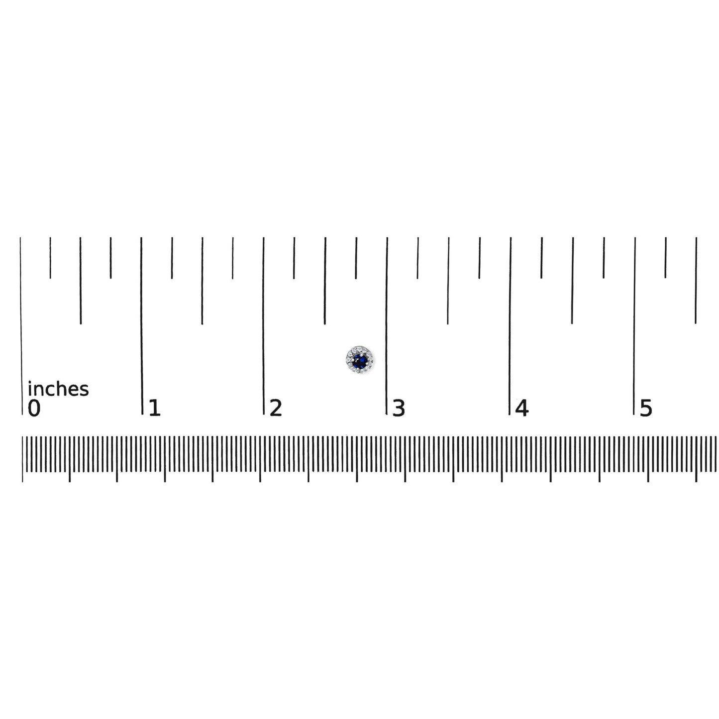 Close-up front view of white metal round stud earring with a blue gemstone center surrounded by small white gemstones, placed on a ruler for size reference.