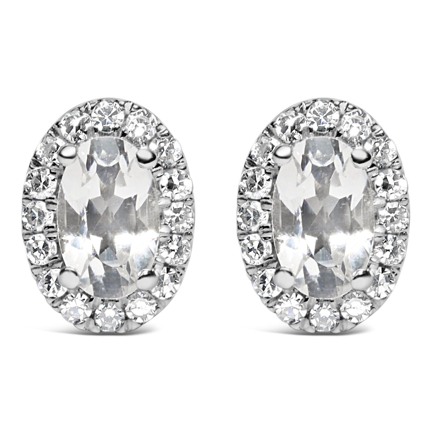 Front angle view of white metal oval-shaped stud earrings with central oval white gemstones in four-prong settings, surrounded by a pave setting of round white gemstones.