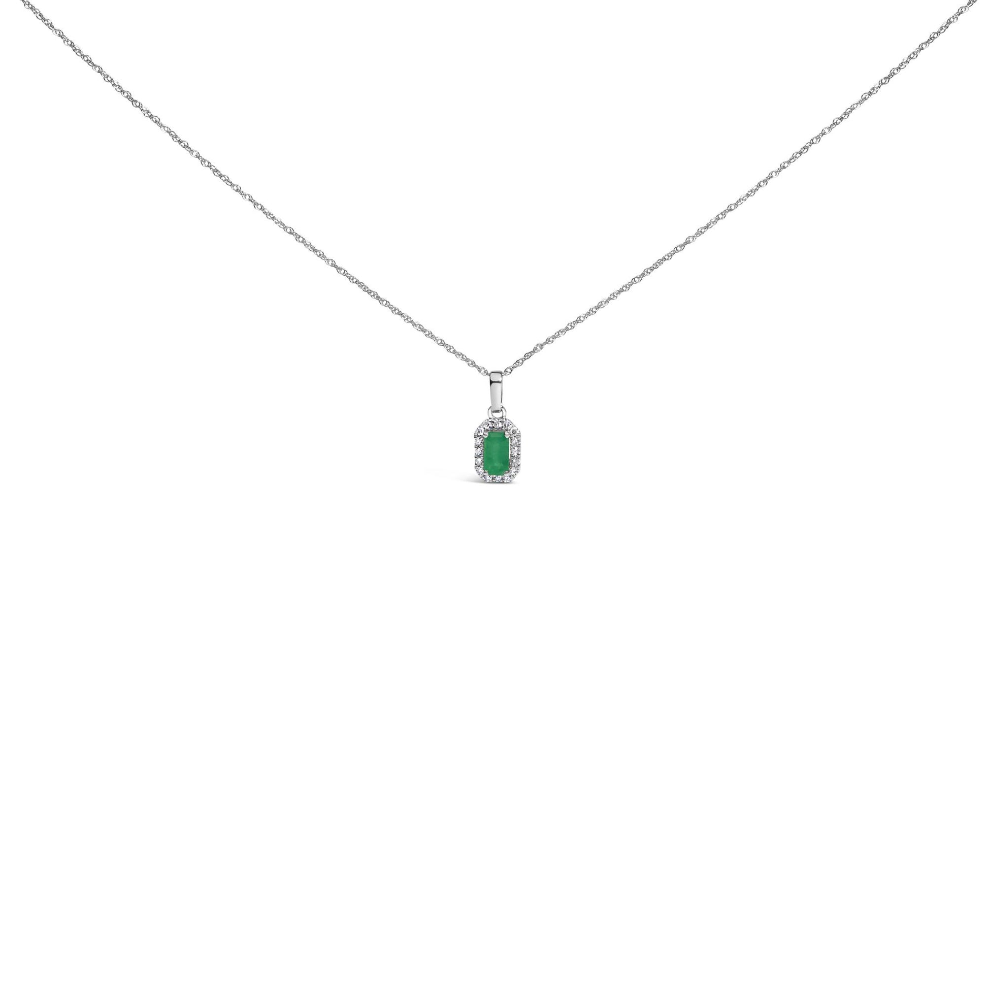 Front view of a white metal necklace featuring a rectangular green gemstone pendant surrounded by small round white gemstones in a micro-pave setting.