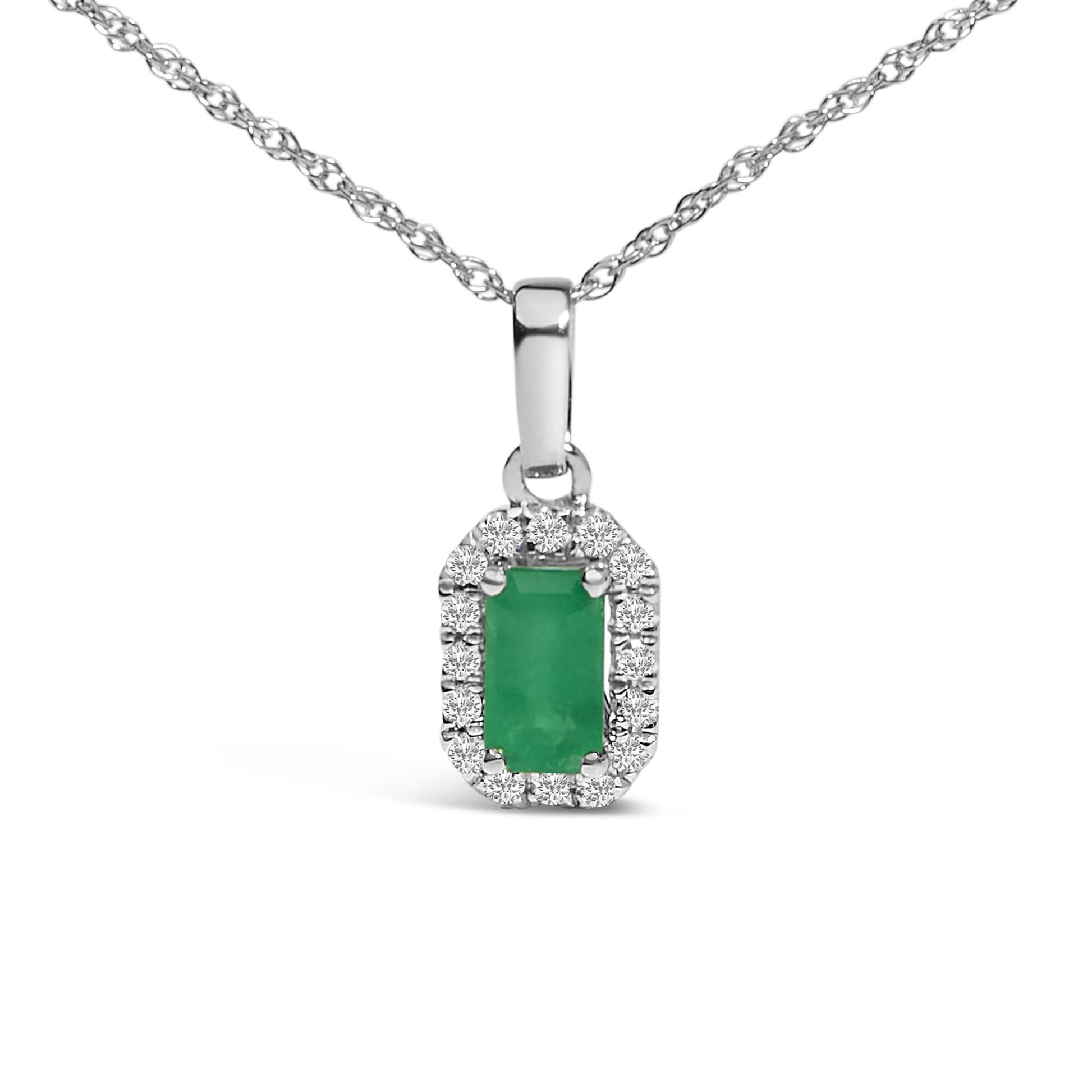 Front view of a white necklace with a rectangular green gemstone pendant surrounded by small round white gemstones in a micro-pave setting.