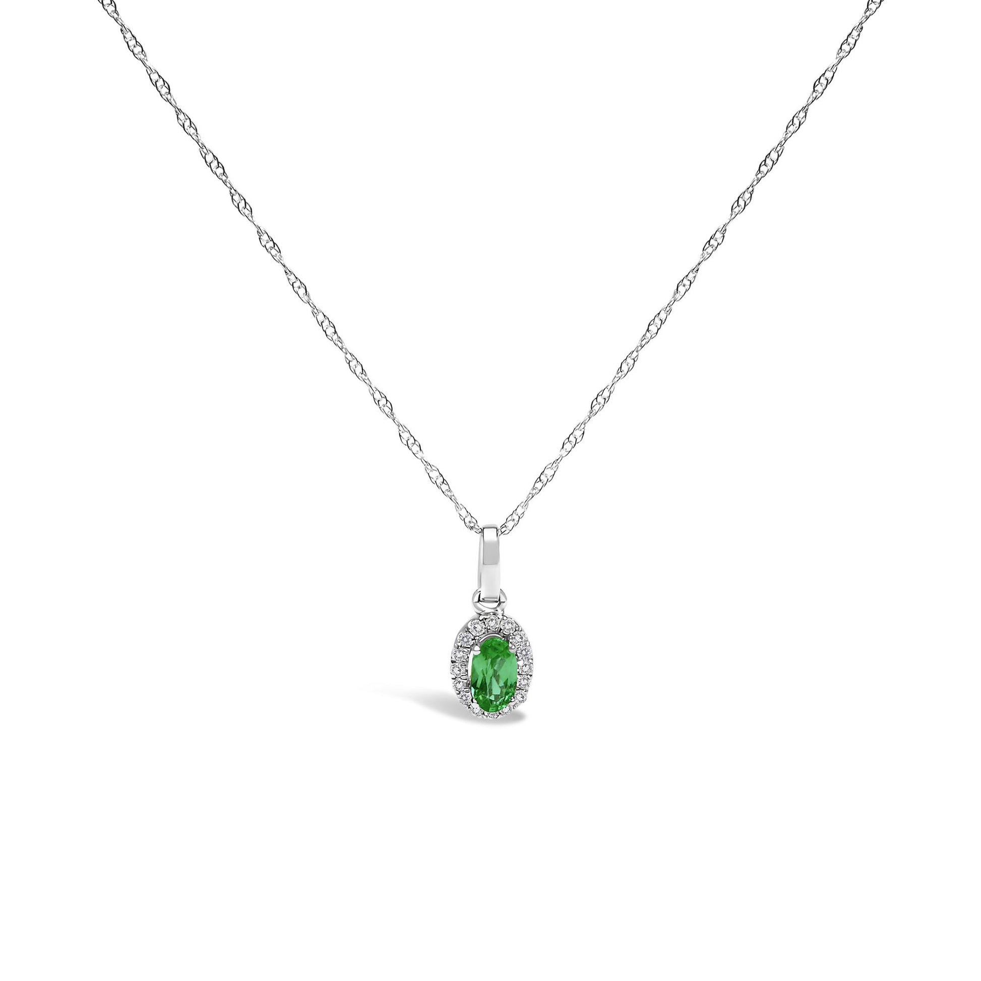 Front view of a white metal necklace with a pendant featuring an oval green gemstone surrounded by small round white gemstones in a micro-pave setting.