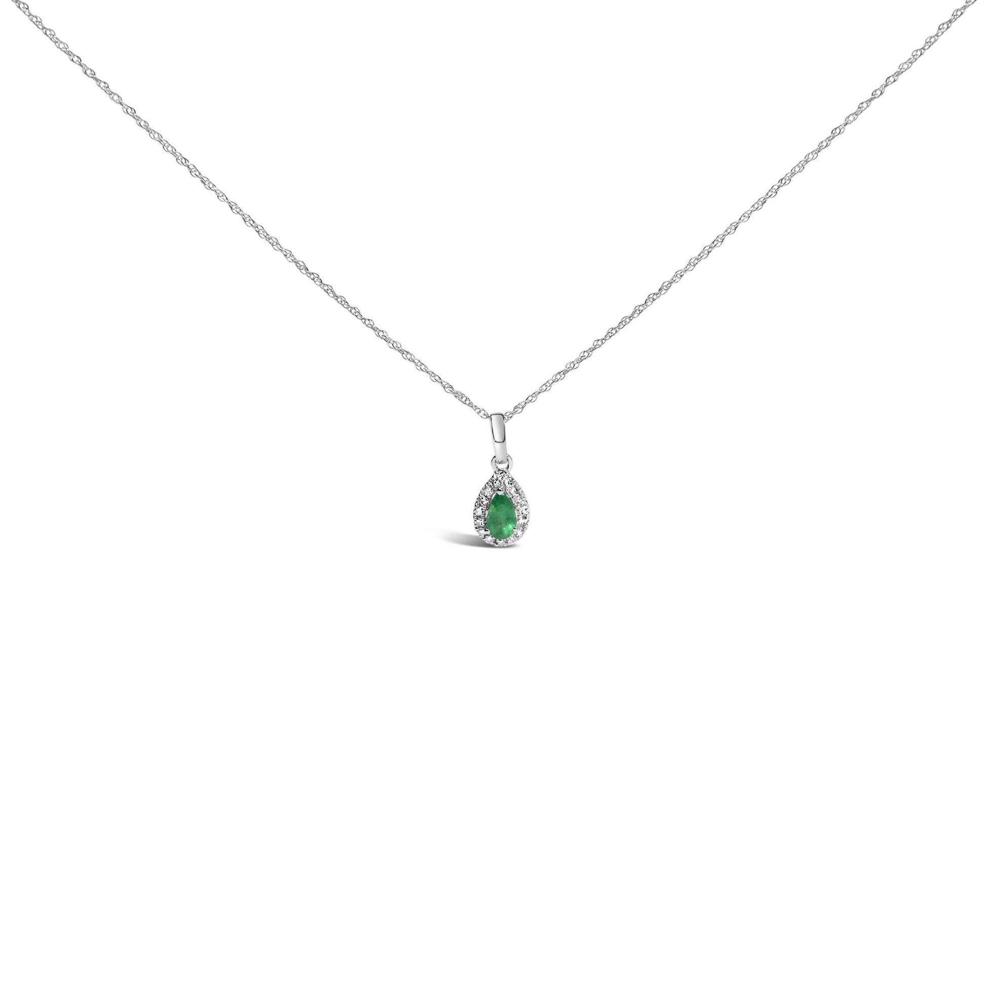 White metal necklace shown from the front with a pear-shaped green gemstone pendant surrounded by small round white gemstones in a micro-pave setting.