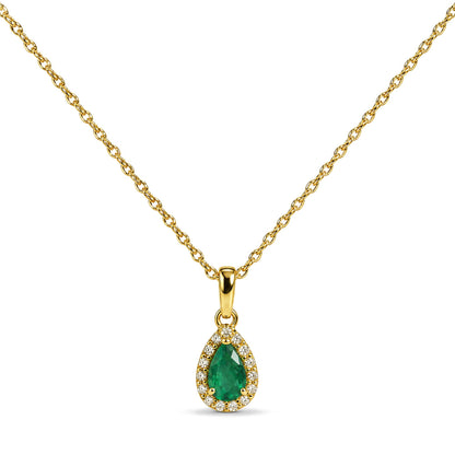 Close-up front view of a yellow necklace with a pear-shaped green gemstone pendant surrounded by small round white gemstones, shown on a white background.