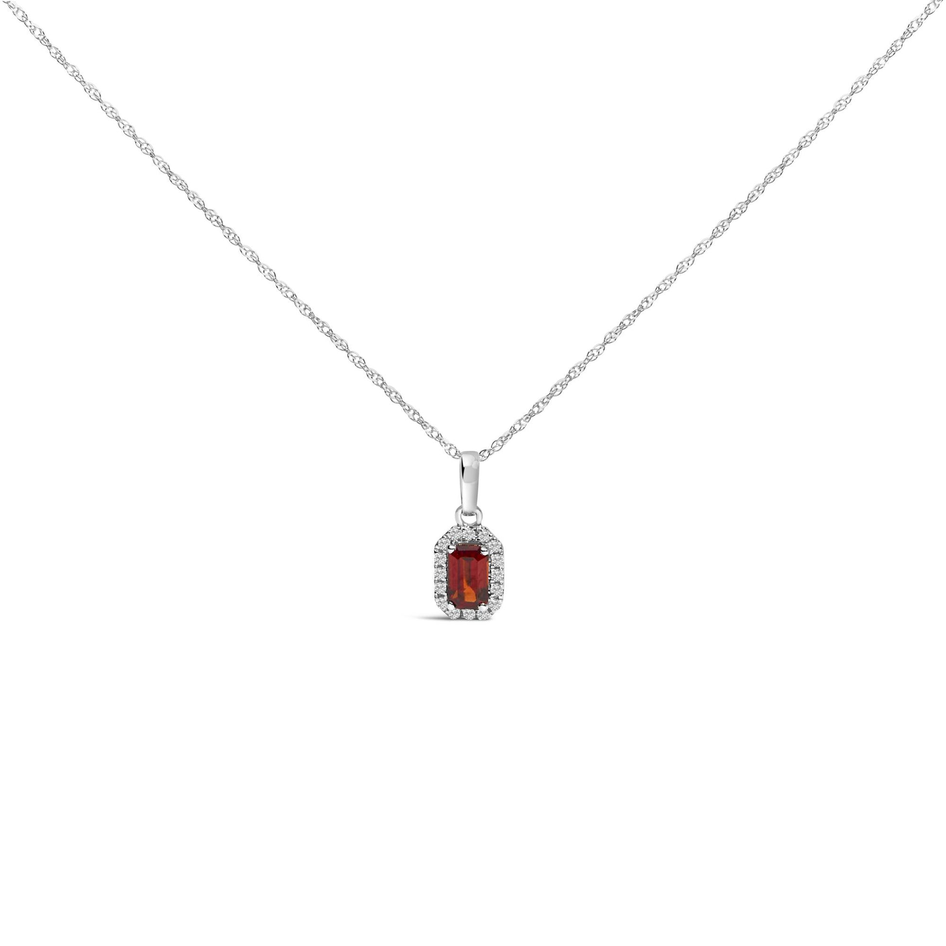 Front view of a white metal necklace with a pendant featuring a rectangular red gemstone surrounded by small white gemstones.
