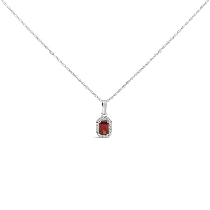 Front view of a white metal necklace with a pendant featuring a rectangular red gemstone surrounded by small white gemstones.