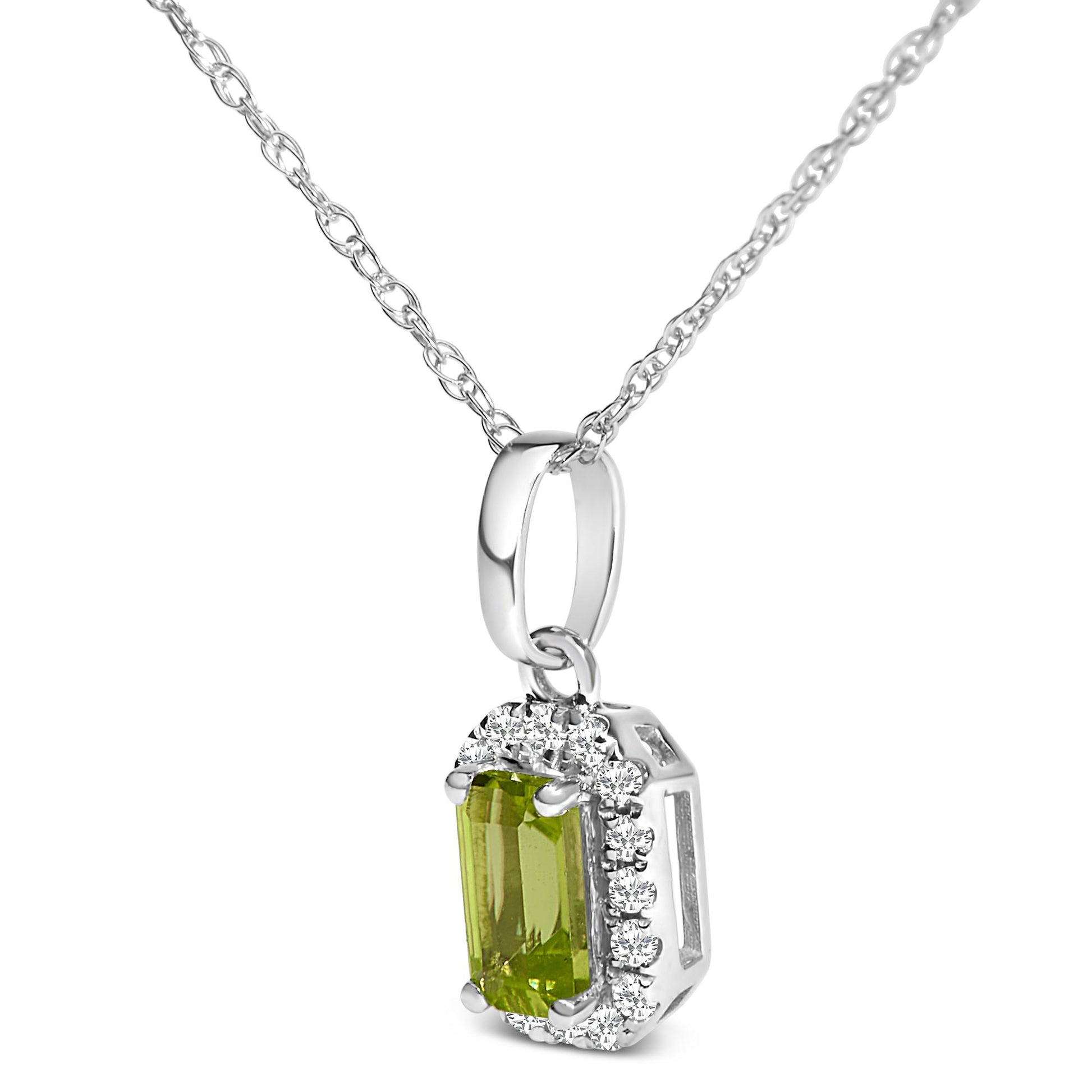 Close-up front angle of a white necklace with a pendant featuring a rectangular yellow gemstone surrounded by small round white gemstones in a micro-pave setting.
