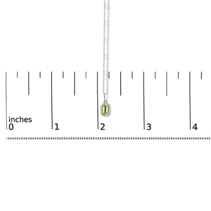 White metal necklace with a rectangular yellow gemstone pendant surrounded by small white gemstones, shown hanging vertically above a ruler for size reference.