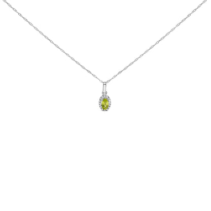 Front-facing shot of a white necklace with a small oval yellow gemstone pendant surrounded by round white gemstones.