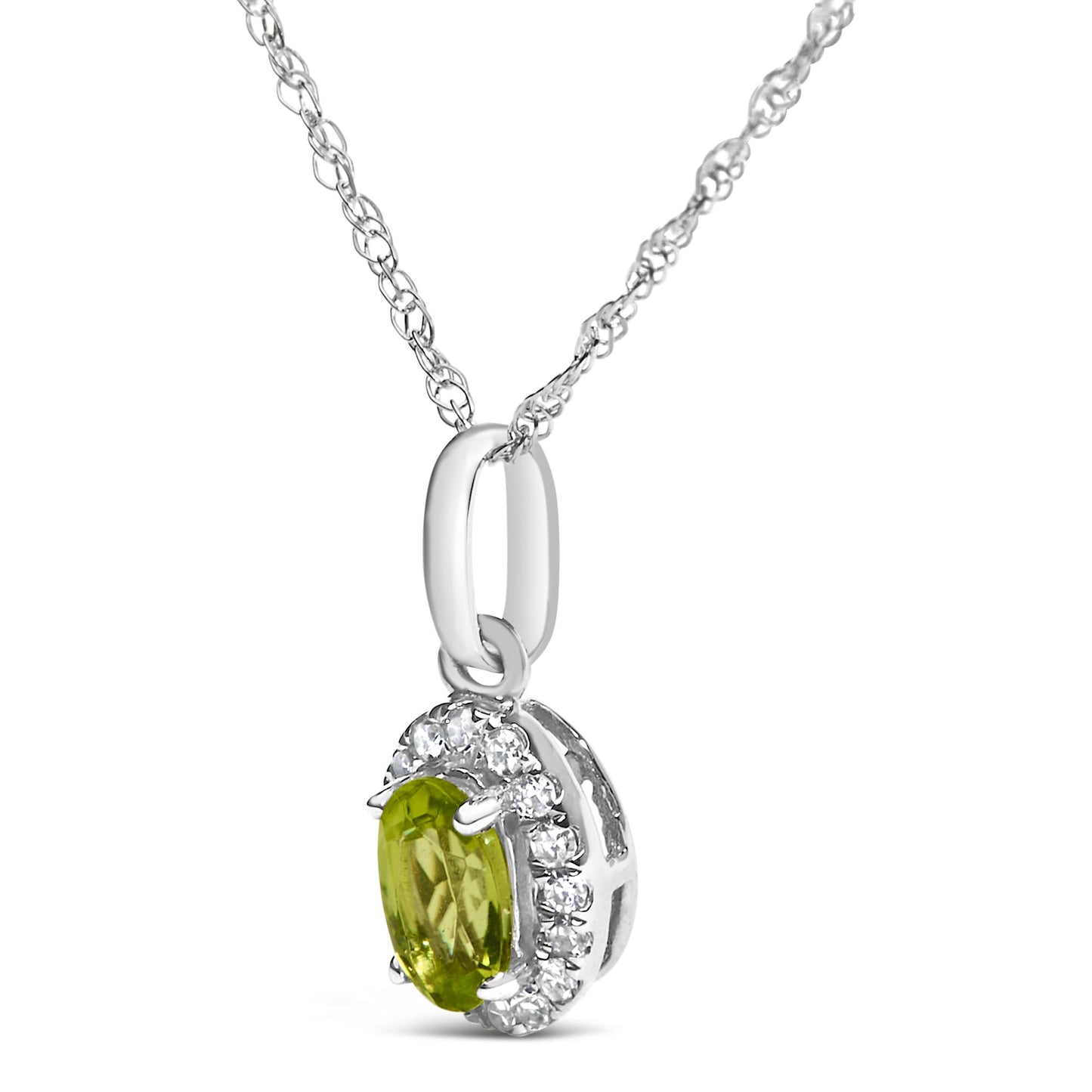 Close-up front angled view of a white metal necklace pendant featuring an oval yellow gemstone with prong setting, surrounded by a halo of round white gemstones in micro-pave setting, hanging from a white metal chain.