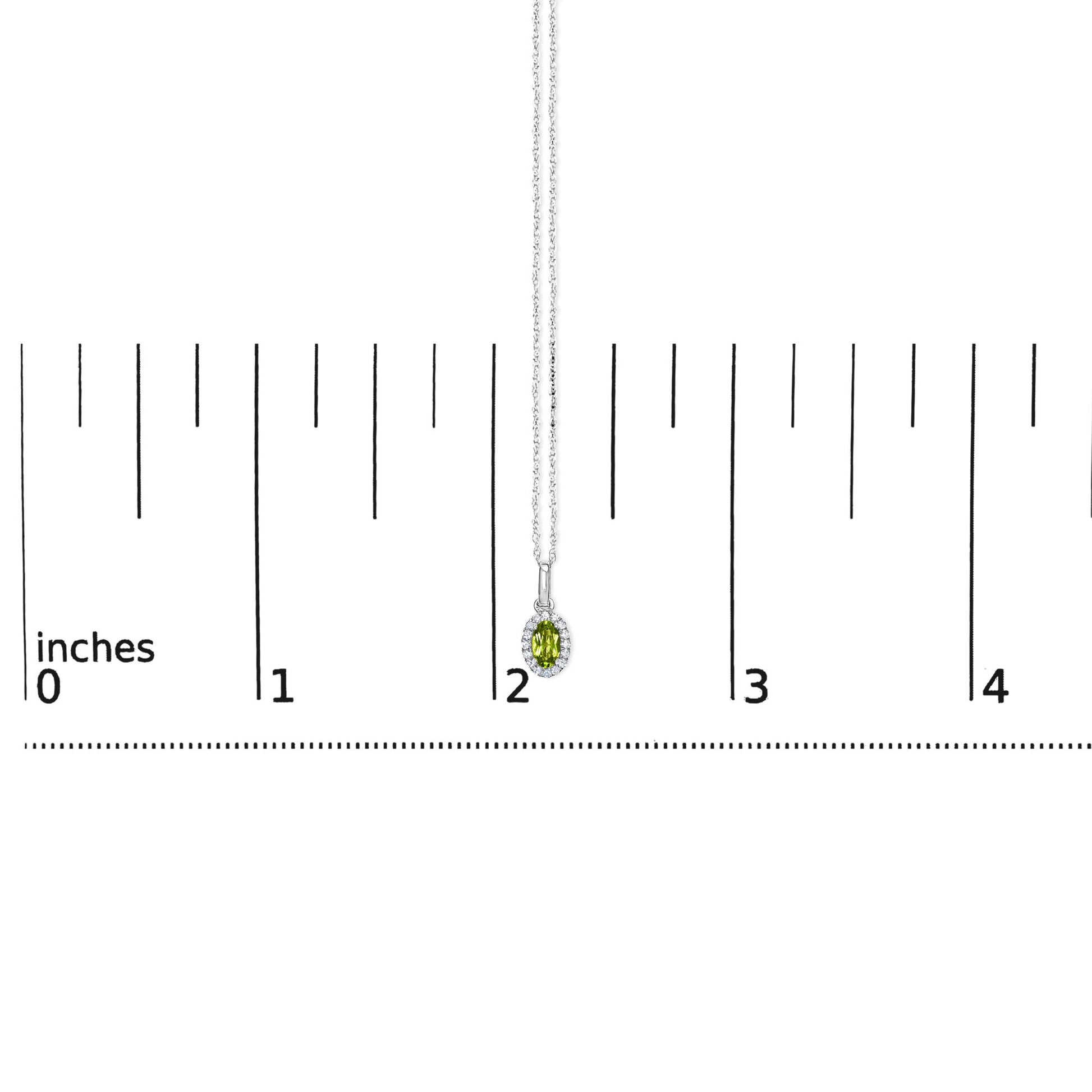 White metal necklace with oval yellow gemstone pendant surrounded by small round white gemstones in micro-pave setting, hanging on a ruler for size reference, shot from the front.