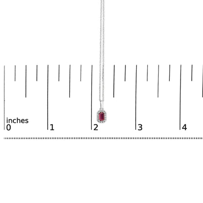 White necklace with a pink oval gemstone surrounded by small white round gemstones, shown on a ruler for size reference, front view.