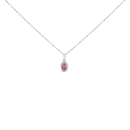 Front view of a white metal necklace with a small pendant featuring a pink pear-shaped gemstone surrounded by round white gemstones in micro-pave setting.