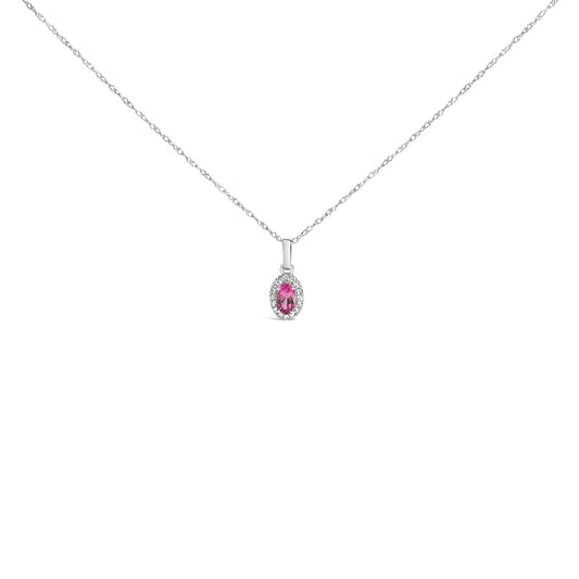 Front view of a white metal necklace with a small pendant featuring a pink pear-shaped gemstone surrounded by round white gemstones in micro-pave setting.