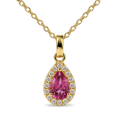 Close-up front view of a yellow metal necklace pendant with a pear-shaped pink gemstone surrounded by round white gemstones, shown on a white background.