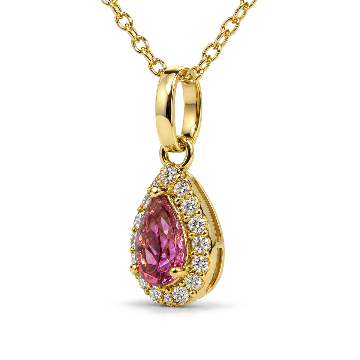 Close-up view of a yellow metal necklace featuring a pear-shaped pink gemstone pendant surrounded by small round white gemstones in prong settings, shown against a white background.