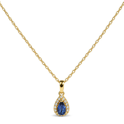 Close-up front view of a yellow necklace chain featuring a pear-shaped blue gemstone pendant surrounded by round white gemstones in prong settings.