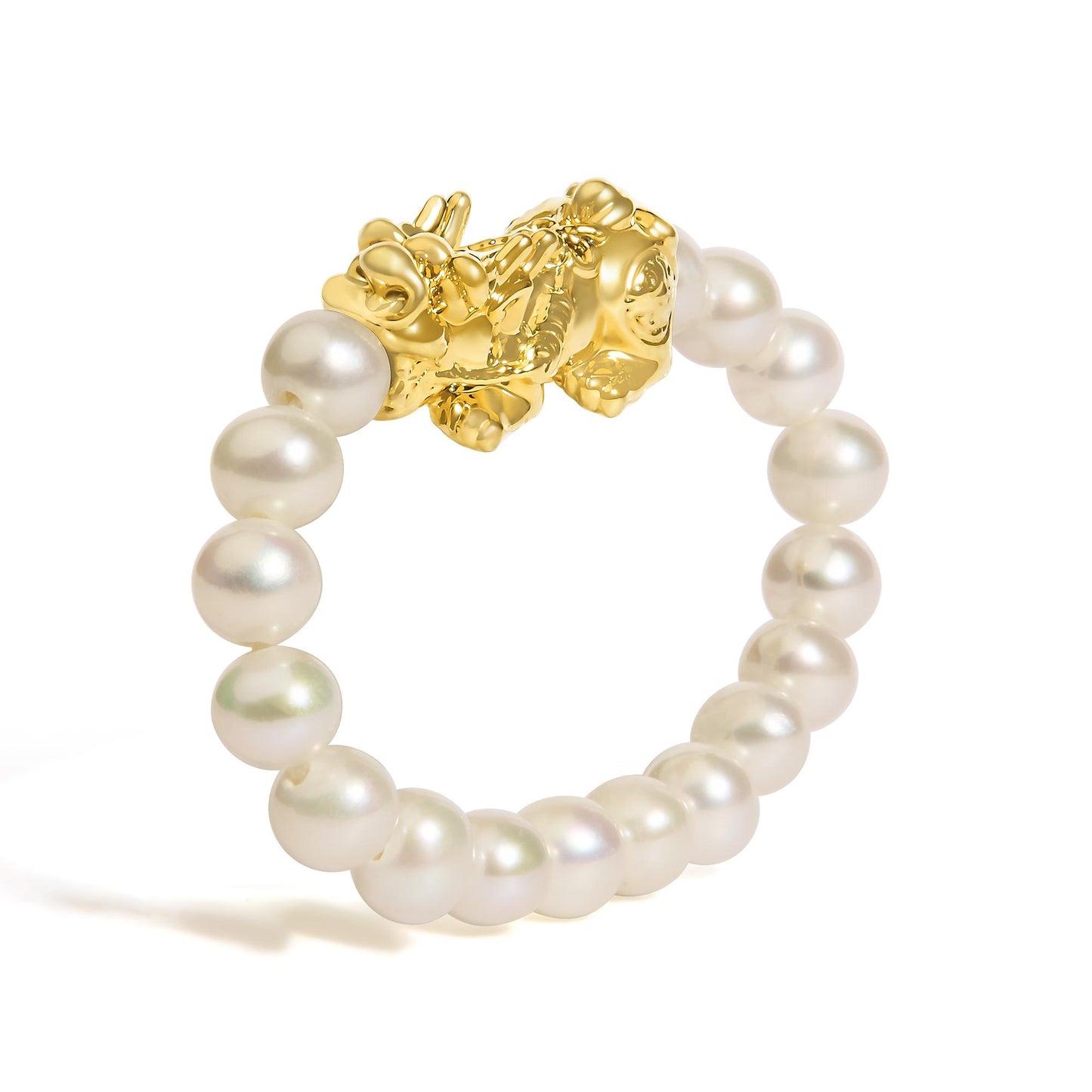 Close-up of a yellow metal ring with a decorative cluster design, shown from the top angle, featuring round white gemstones arranged around the band.