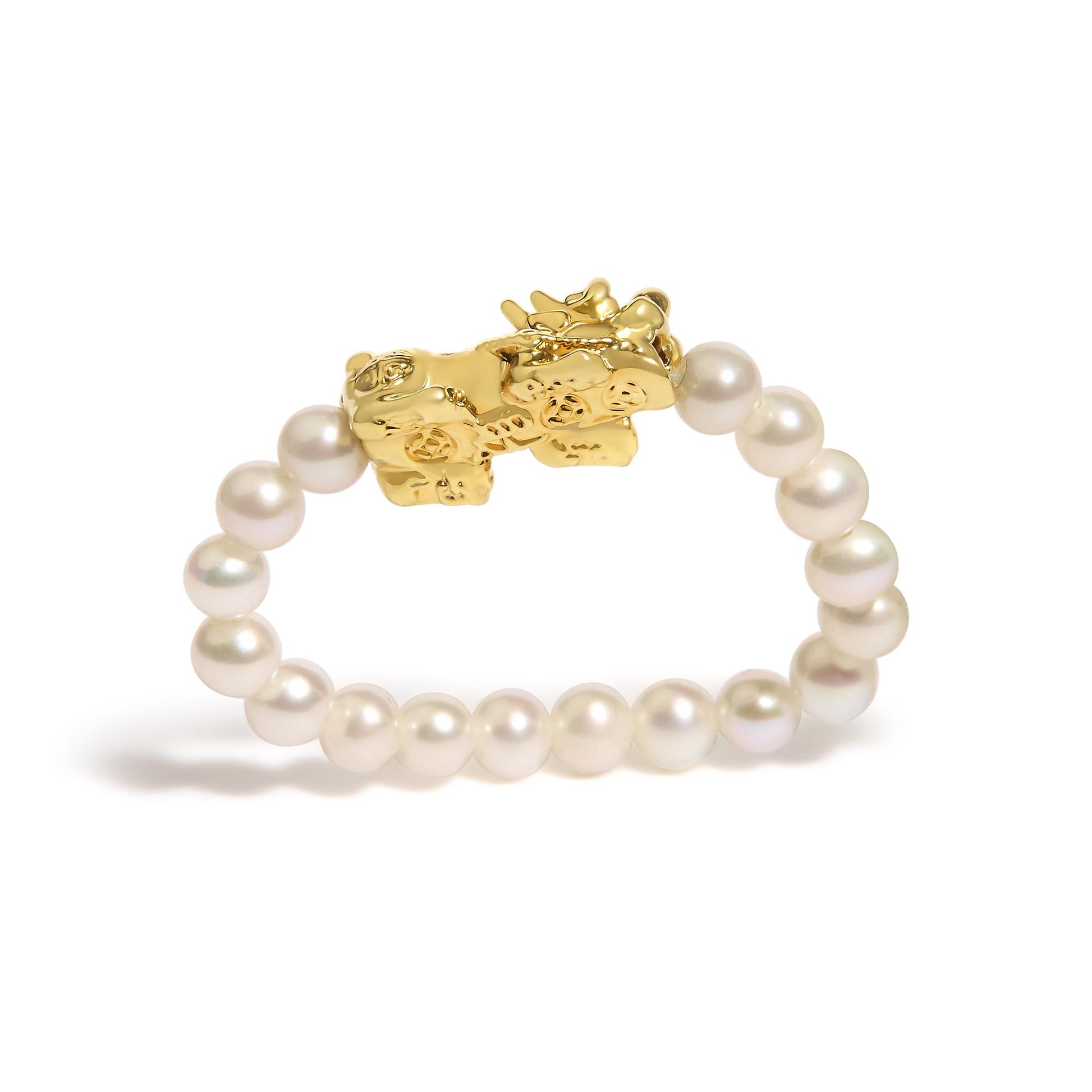 Close-up front angle of a yellow metal ring with an artistic animal design and a band made of white round gemstones.
