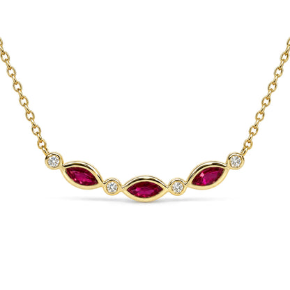 Yellow metal necklace shown in a close-up front angle, featuring marquise-shaped red gemstones with prong settings alternating with round white gemstones in bezel settings along the chain.