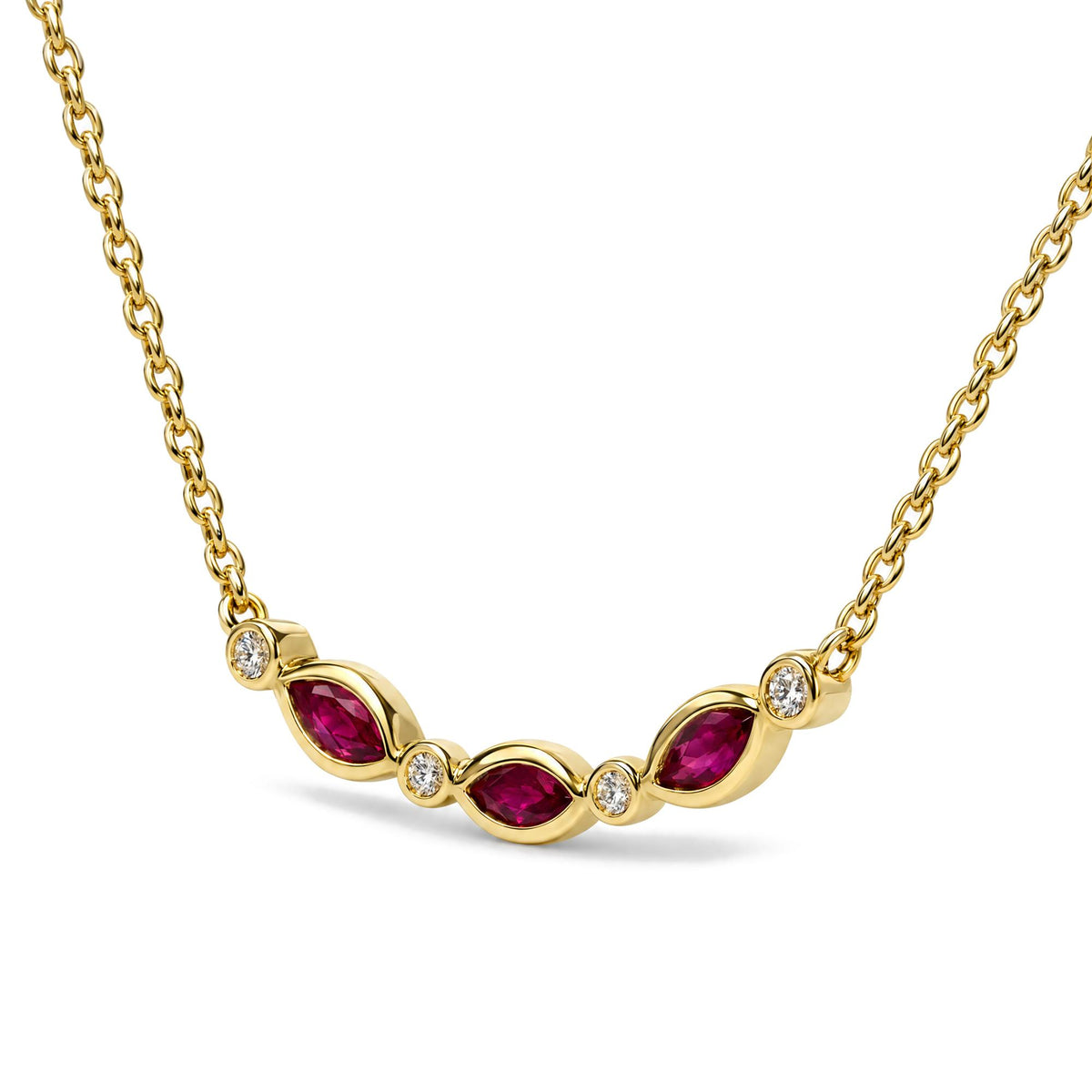 Close-up front angle of a yellow metal necklace with alternating marquise-shaped red gemstones in prong settings and round white gemstones in bezel settings, shown on a white background.