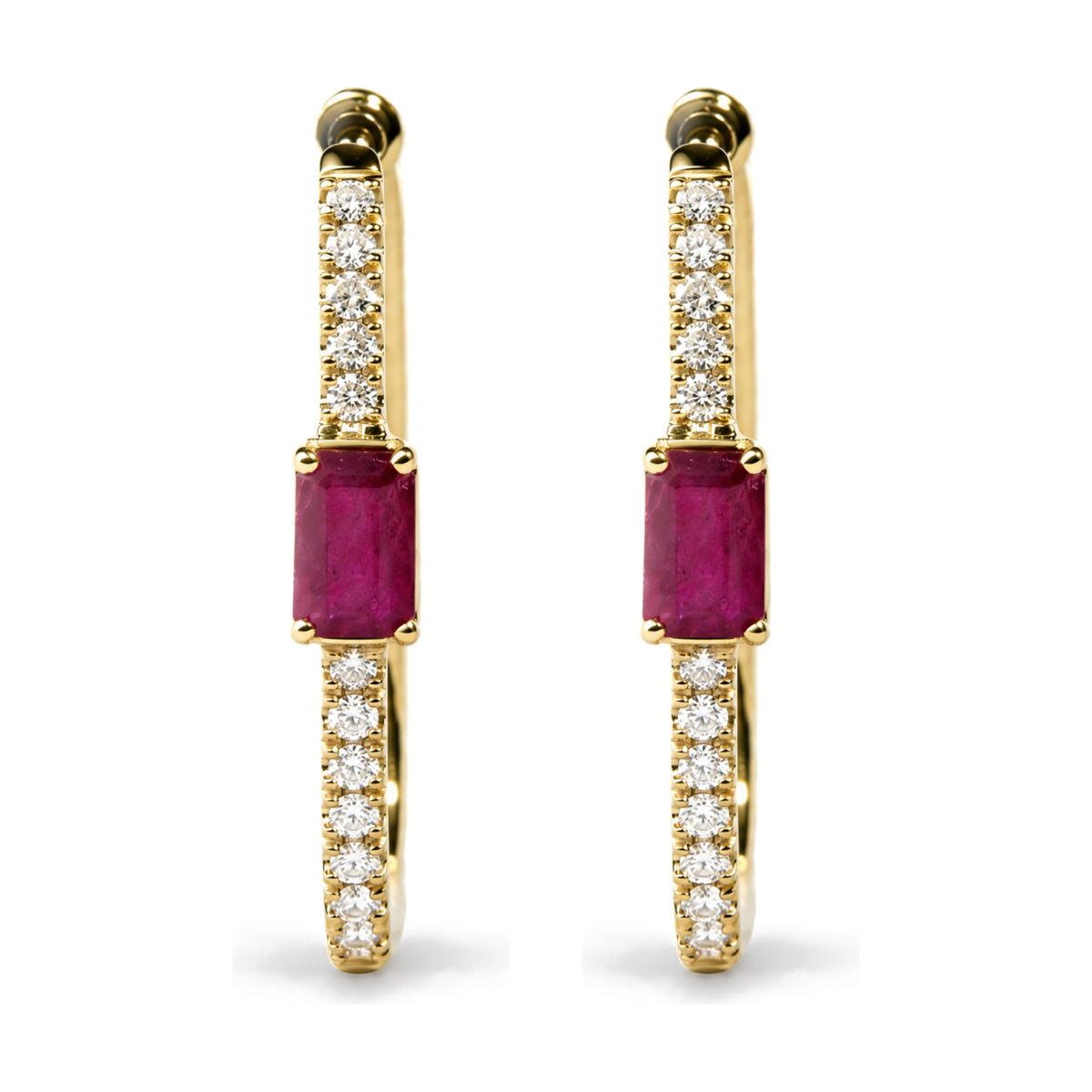 Close-up front view of a pair of yellow metal hoop earrings shown on a white background. Each earring is adorned with small round white gemstones set along the hoop and features a larger red gemstone in a prong setting at the bottom.
