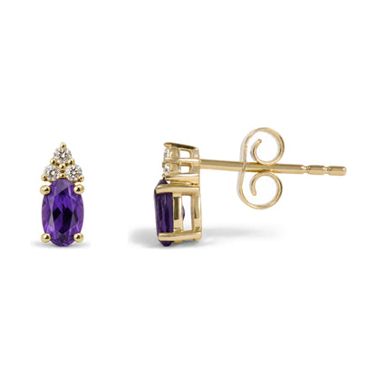 Close-up side and front view of a pair of yellow metal earrings with a central oval purple gemstone and multiple round white gemstones above, shown on a white background.