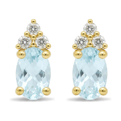 Close-up front view of yellow metal earrings featuring an oval blue gemstone with three round white gemstones arranged above it in a triangular pattern, all in prong settings.