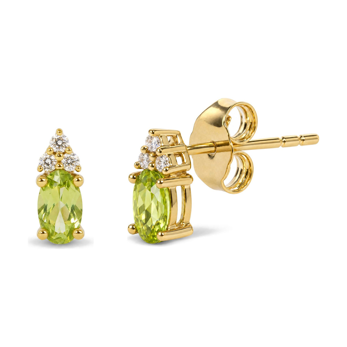 Close-up angled view of yellow metal stud earrings featuring an oval green gemstone below a triangle of round white gemstones in prong settings.