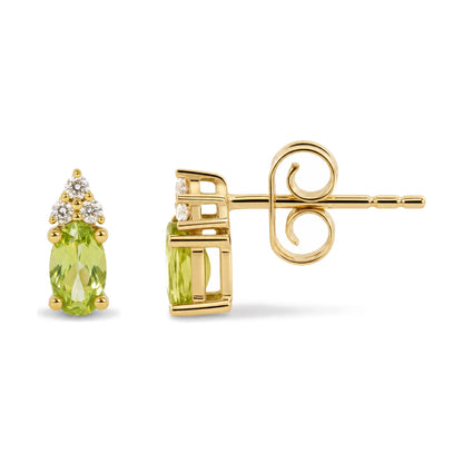 Close-up side view of a yellow metal earring with an oval green gemstone set below a cluster of round white gemstones, shown against a white background.